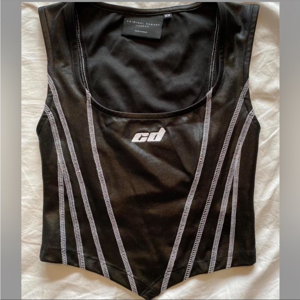 criminal damage top